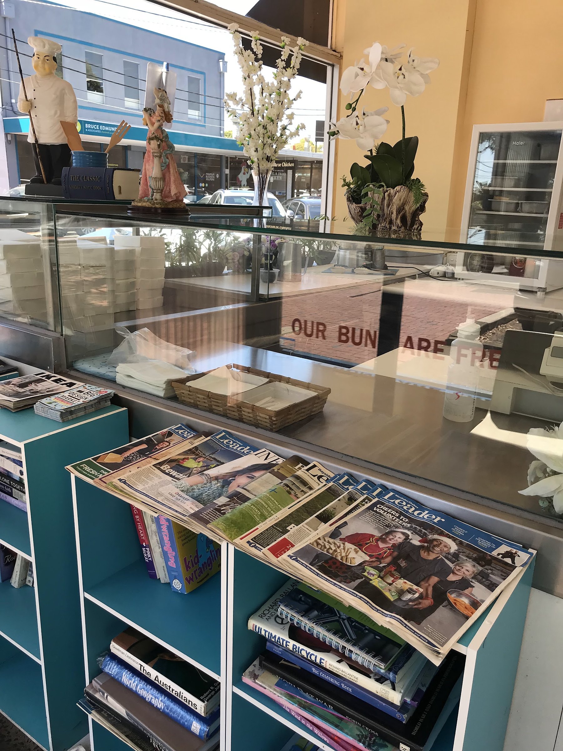 The front counter, with local papers and books to read while you wait